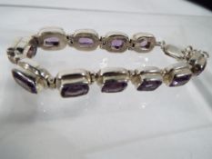 A lady's silver bracelet, stone set - This lot MUST be paid for and collected, or delivery arranged,