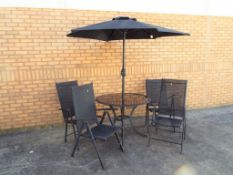 A garden table and chair set with winding parasol and LED lights,