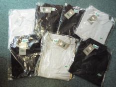 Seven gentleman's polo t-shirts bearing Lacoste logo in clear film packaging with tags,