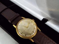 A gentleman's 1960s Timex watch with brown leather condor strap,