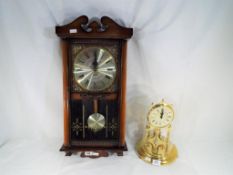 An Anniversary clock with Roman numerals to the dial and good quality glass dome and a wall clock,