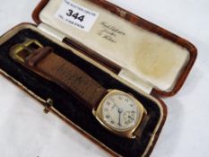 A lady's 9 carat gold cased wristwatch, assay mark for 1946, square form with silvered dial,