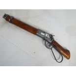 A replica Winchester underlever 'mares leg' rifle with moving underlever action - Est £30 - £50 -