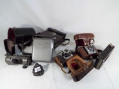 A good mixed lot to include a small of vintage cameras by Emik model #35,
