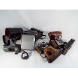 A good mixed lot to include a small of vintage cameras by Emik model #35,