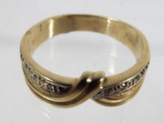 A lady's 9ct gold ring set with diamonds, size S approx, weight 4.