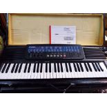 A Casio CT - 647 electronic keyboard set in wooden carry case with instruction manual and power