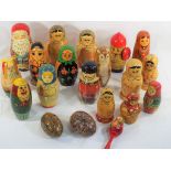 A collection of seventeen Russian lacquered dolls ranging from 9 cm (h) to 19 cm,