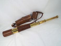 A good quality brass telescopic telescope with leather carry case marked T.