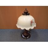 A large good quality table lamp with glass shade with floral decoration,