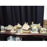 Eleven models of cottages, castles and similar to include Lenox, David Winter,