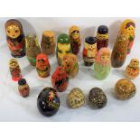 A collection of seventeen Russian lacquered dolls ranging from 8 cm (h) to 19 cm,
