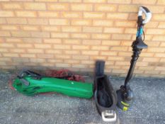 An electric garden vacuum with leaf shredder and a hand-held lawn strimmer (2) - This lot MUST be