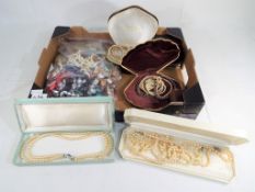 A jewellery box and a bag of assorted costume jewellery to include various boxed sets of pearl