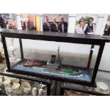 Two model boats in glass display case,