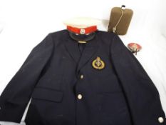 A blazer bearing a Royal Marine Commando badge, Royal Marine dress cap,
