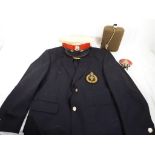 A blazer bearing a Royal Marine Commando badge, Royal Marine dress cap,