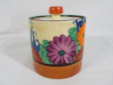 Clarice Cliff - a Clarice Cliff round lidded pot in the Gay Day pattern,