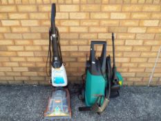 A good quality Bosch pressure washer and a Vax Rapide carpet washer (2) - This lot MUST be paid for