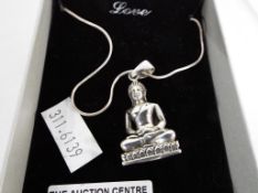 A silver necklace and pendant in the form of a Buddha - This lot MUST be paid for and collected,