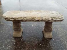 Garden Stoneware - a curved stone bench with plinths in the form of squirrels.
