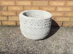 Garden Stoneware - Two circular stone planter decorated with Aztec design on a circular base.