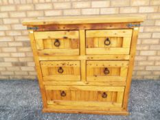 A solid pine set of drawers, two over two over one, approximate height 90 cm x 87 cm x 44 cm.