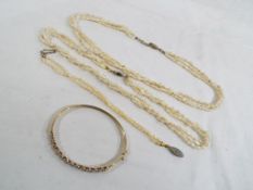 Two triple stranded sea pearl necklaces with a matching double stranded bracelet,