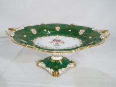 Royal Crown Derby - a large green tazza by Royal Crown Derby with floral and gilt decoration,