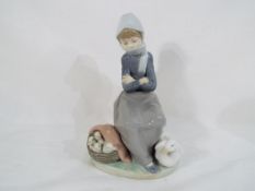 Lladro - a Lladro figurine #1267 entitled The Duck Seller, stamped and incised marks to the base,