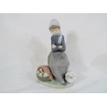 Lladro - a Lladro figurine #1267 entitled The Duck Seller, stamped and incised marks to the base,