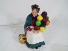 Royal Doulton - a Royal Doulton figurine entitled The Old Balloon Seller, model no.