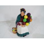 Royal Doulton - a Royal Doulton figurine entitled The Old Balloon Seller, model no.