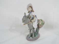 Lladro - a Lladro figurine entitled Look at Me #5465 depicting a girl riding a donkey,