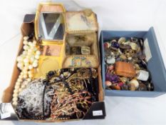 Two boxes containing a large quantity of costume jewellery to include bracelets, necklaces,
