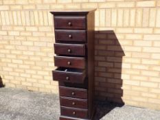 A good quality tallboy with nine drawers,