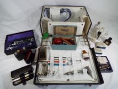 A doctor's case containing a quantity of medical equipment and accessories W.H.