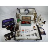 A doctor's case containing a quantity of medical equipment and accessories W.H.