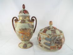 Two pieces of Japanese porcelain to include a twin-handled lidded urn,