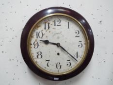 An Ansonia wall clock, Arabic numerals on a 29 cm diameter white dial scribed Ansonia Clock Co,