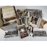 In excess of 600 UK topographical early-mid period postcards with many real photo types and street