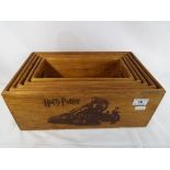 Five graduated wooden trays depicting Harry Potter Magic,