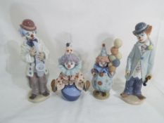 Lladro - four Lladro clown figurines to include #5813 Having a Ball, #5811 Littlest Clown (a/f),