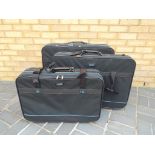 A set of three canvas nesting suitcases - This lot MUST be paid for and collected,