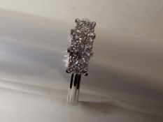 A lady's 9 carat white gold 25 point 1/4 carat diamond cluster ring, approx 2.