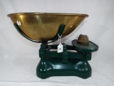 A set of large cast iron and brass weighing scales with weights 33 cm (h) - This lot MUST be paid