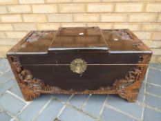 A 20th century African carved wood linen chest, 40 cm x 73 cm x 35 cm,