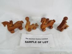 32 wooden push along toys to include sea