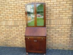 A astral glazed display cabinet with dro