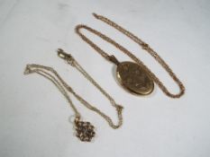 A hallmarked yellow gold locket with a 9ct gold chain and a 9ct gold fine belcher chain with
